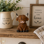 Sitting Highland Cows