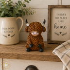 Sitting Highland Cows