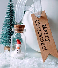 Load image into Gallery viewer, Hand Crafted Santa Snowman In Glass Bottle
